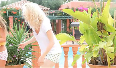 Two skinny teenies with nice titties and fat asses feel each other up in garden