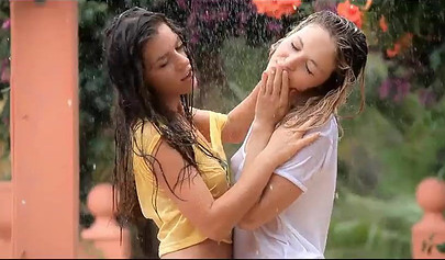 Two skinny teenies with nice titties and fat asses feel each other up in garden