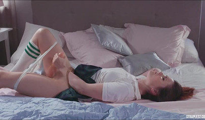 Gorgeous lesbo with pink hair and her female college friend fuck with strapless dildo