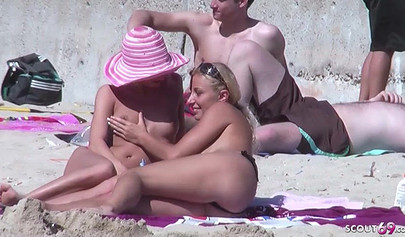 Real MILF German lesbians get caught while having great sex on a public beach