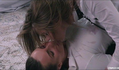 These lesbos don't need any security when fucking with a strapless dildo in this vid