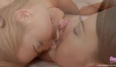 Alexis Crystal and her friend have hot lesbo sex on the white living room couch