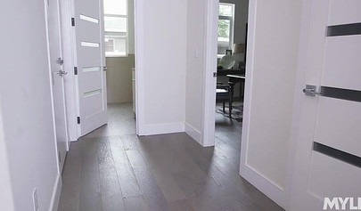 Dark haired babe and blonde have lesbian sex on the white living room couch