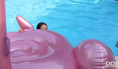 Two brunettes hit the pool deck after swimming in the pool to scissor like sluts