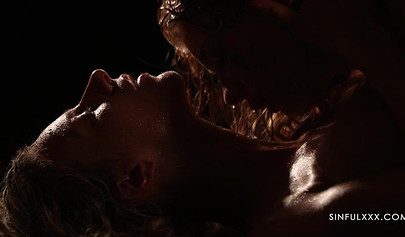 A pair of lesbians have sex in a romantic setting with great lighting and shots