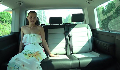 Playful lesbians play with each other on the backseat of a car and suck a fat dick