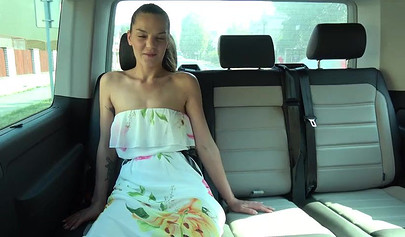 Playful lesbians play with each other on the backseat of a car and suck a fat dick