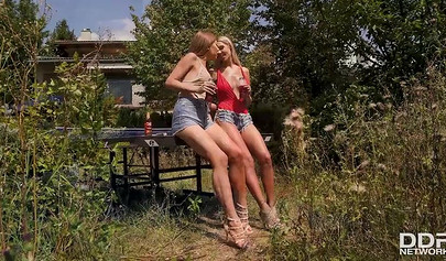 Cute lesbians use sex toys to fuck their holes and play with their petite feet