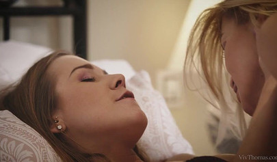 Beautiful lesbian babes with slim bodies in lingerie passionately lick each other