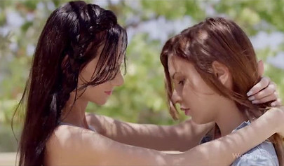 Playful young lesbians strip next to a tree outside to enjoy sloppy pussy licking