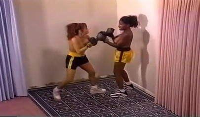 Nymph lesbian interracial Milfs with big tits are having a brutal boxing session