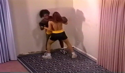 Nymph lesbian interracial Milfs with big tits are having a brutal boxing session