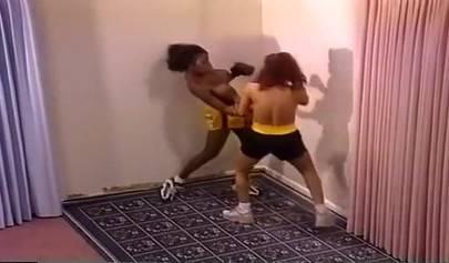 Nymph lesbian interracial Milfs with big tits are having a brutal boxing session