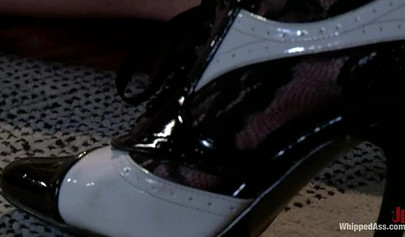 Kinky lesbians are having a threesome that involves a heavy bondage action