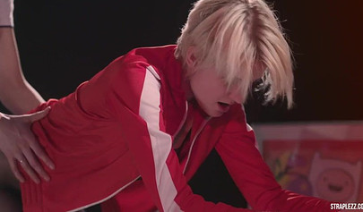 Short haired lesbian is happy that her partner is banging her with a strapon