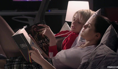 Short haired lesbian is happy that her partner is banging her with a strapon