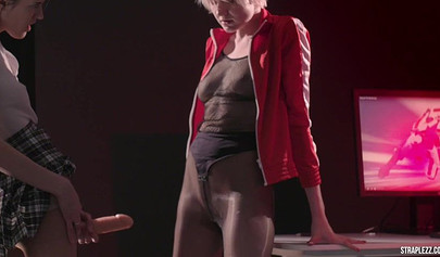 Short haired lesbian is happy that her partner is banging her with a strapon