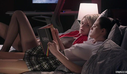 Short haired lesbian is happy that her partner is banging her with a strapon