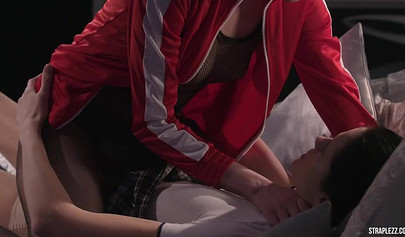 Short haired lesbian is happy that her partner is banging her with a strapon