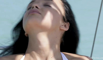 Beautiful young babes enjoy passionate lesbian licking and kissing on a yacht