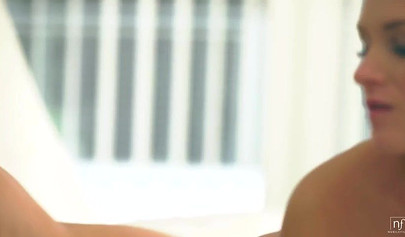 Brunette chick seduces a busty blonde and makes her do sensual lesbian stuff