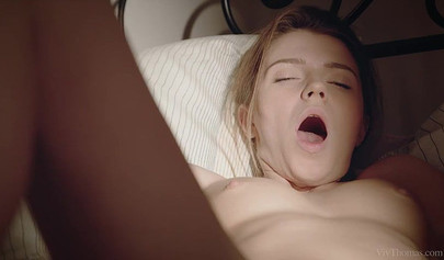 Two lesbian teens touch each others cunts in a small and really romantic bedroom