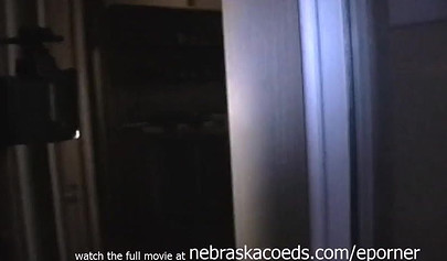 Short-haired lesbian is fucking her pussy with banana after getting naked