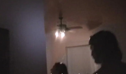 Short-haired lesbian is fucking her pussy with banana after getting naked