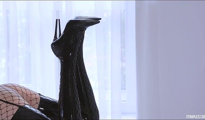 Fetish girl on girl sex with some latex and fishnets and a big thick strap on