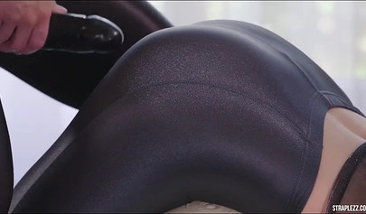 Lesbian fetishists have a round of sex with a massive dildo while at the gym