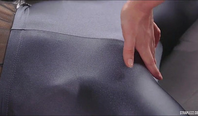 Lesbian fetishists have a round of sex with a massive dildo while at the gym