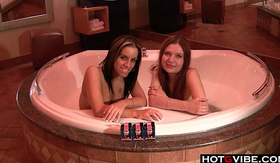 Young hotties get turned on in the bathtub and end up having sensual lesbian sex