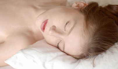 Petite young babe enjoys getting a soft and sensual lesbian massage and rubbing