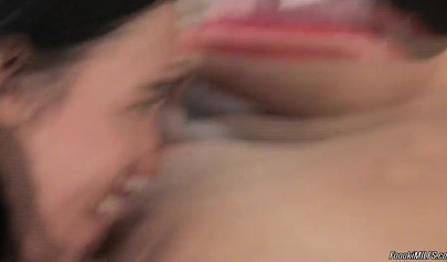 Dark-haired lesbians use double-sided dildo in their sex