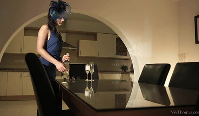 Elegant ladies satisfy each other on a white couch