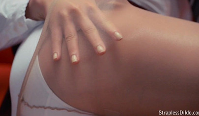 Strict mistress punishes her slave with a strap-on