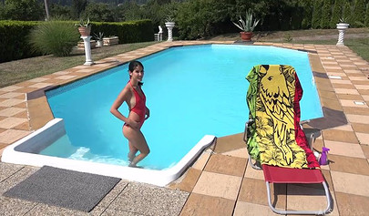 Sexy brunette play with her twat by the pool