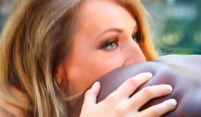 Natasha Starr and Ana Foxxx play with a red dildo by the pool