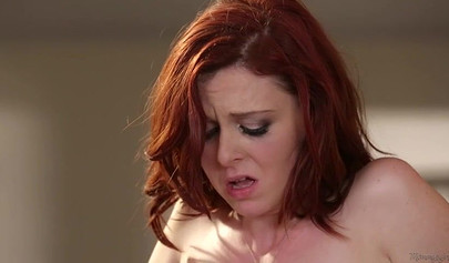 Syren De Mer and Emma Evins have sex on a black couch