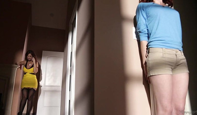 Syren De Mer and Emma Evins have sex on a black couch