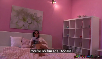 Blonde and brunette have fun in a cozy pink room