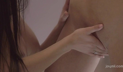 Blonde and brunette play with a pink dildo