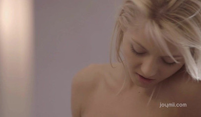 Blonde and brunette play with a pink dildo