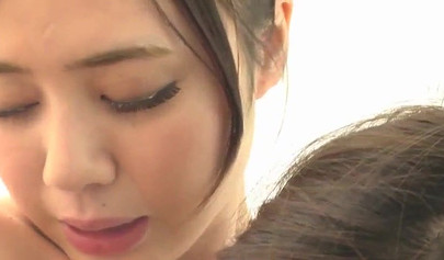 Shy Asian lesbians moan seductively while being licked and fucked with dildos