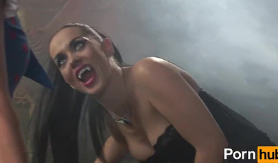 Vampire girl having fun with a nice blonde in a dark room