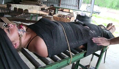 Two experienced MILFs practice bondage in the garage