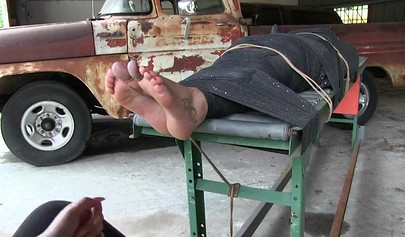 Two experienced MILFs practice bondage in the garage