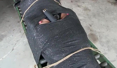 Two experienced MILFs practice bondage in the garage