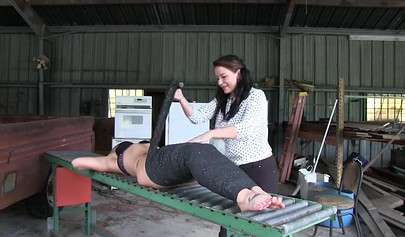 Two experienced MILFs practice bondage in the garage