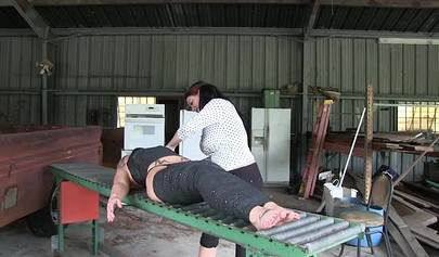 Two experienced MILFs practice bondage in the garage
